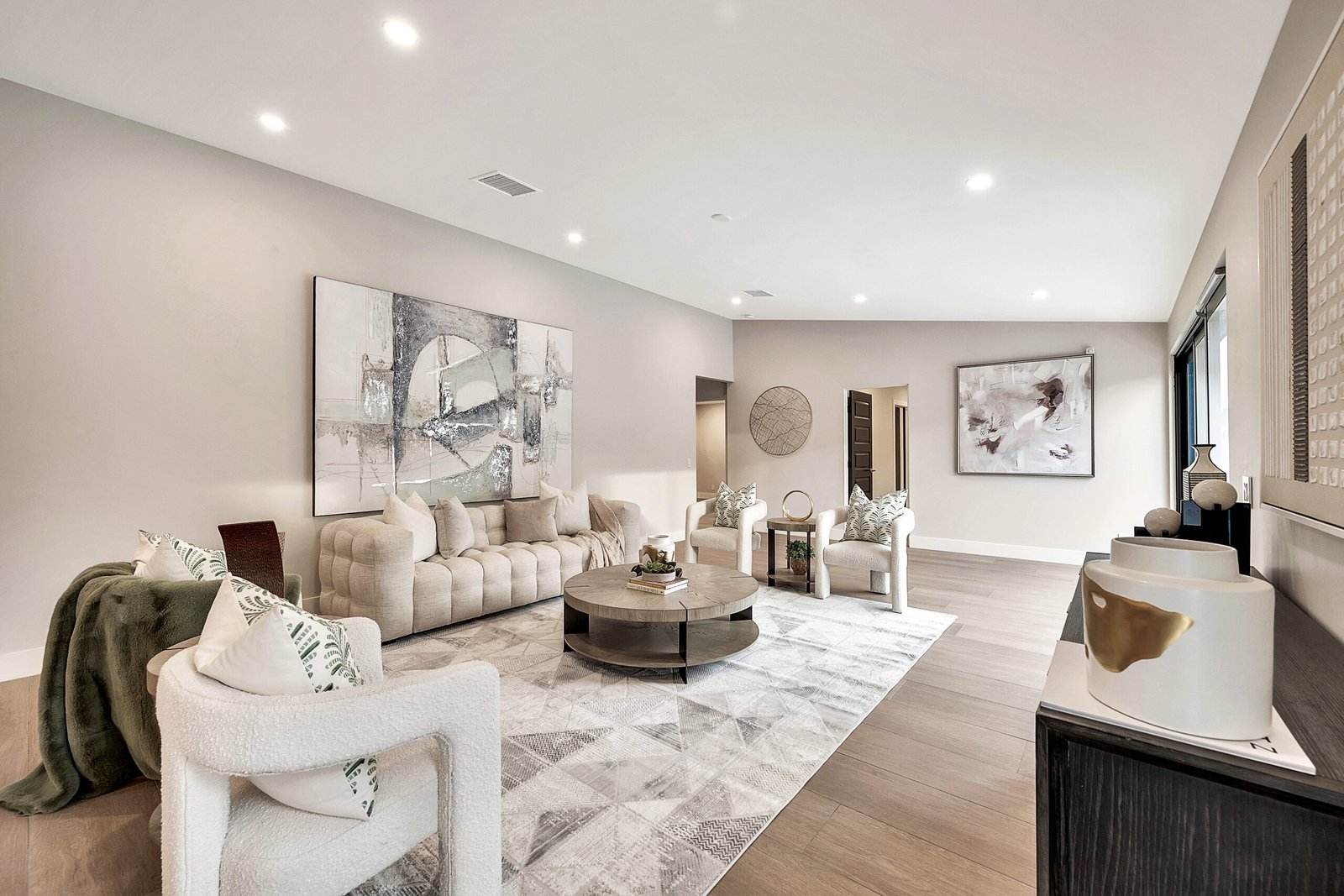 Home Bright modern living room remodel with recessed lighting and neutral finishes